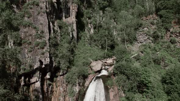 Waterfall Korbu in forest of Altai