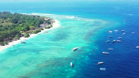 Aerial view panorama of tranquil lagoon beach voyage by blue water with bright sand background of a 