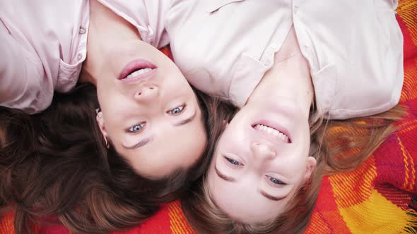 Happy bloggers. Lesbian couple making video call. Girls selfie. Close-up of pretty faces. Students.