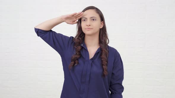 Proud Indian girl saluting