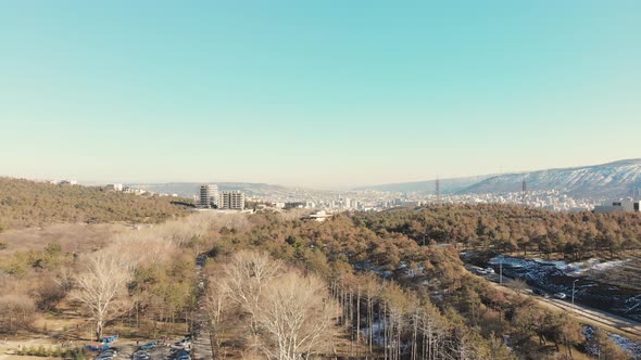Approaching Aerial View Of Tbilisi City In Caucasus Mountains