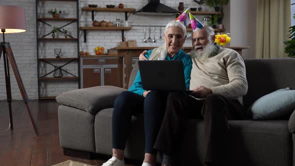 Happy Elders Congratulating Child with Birthday