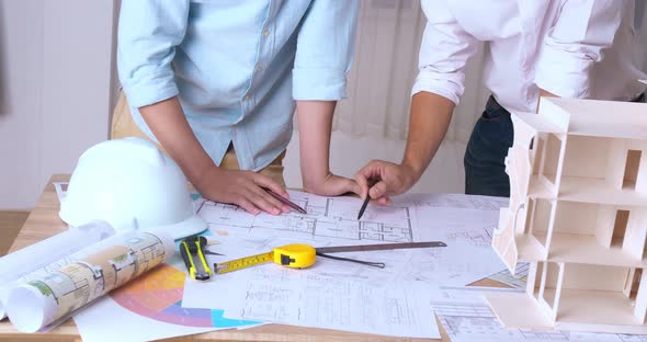 Engineers Working Together In A Architect Studio