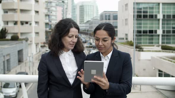 Content Businesswomen Using Tablet Computer