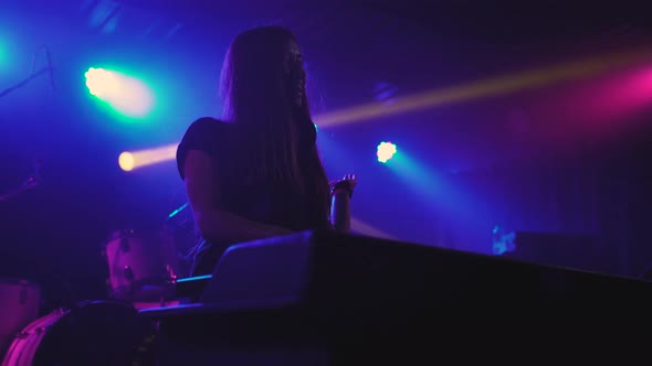 Beautiful Young Woman DJ Play the Music on the Mixing Console in the Nightclub