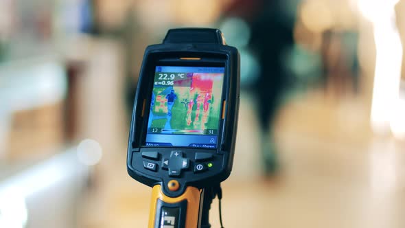 Thermographic Device with Temperature Indicators on the Screen. Body Temperature Detecting, Covid-19