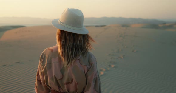 Slow Motion Woman Enjoying Golden Sunset Over Ocean, Walking By the Sand Dunes