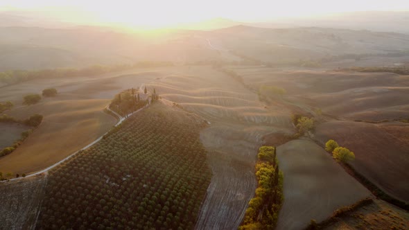 Val d'Orcia Valley with Farmhouse, Cypress Trees and Rolling Hills, Tuscany Aerial View