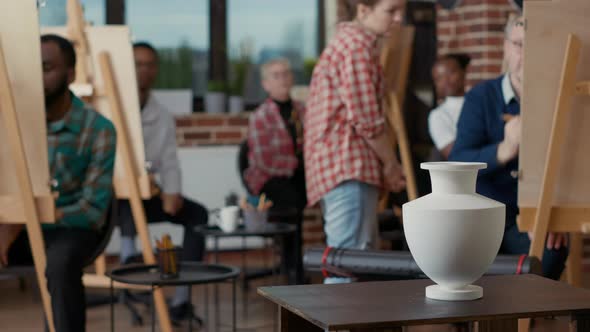 Vase on Table Used As Inspiration Model for Students to Draw on Canvas