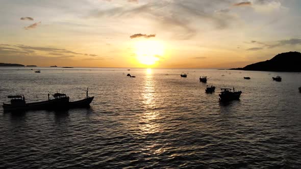 Zooming in the sun at sunset on the water. Boat. Quy Nhon. Vietnam