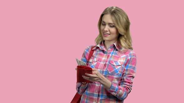 Cheerful Girl Gets Money From Her Red Purse