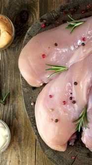 Fresh Raw Chicken Breast Fillets Sprinkled with Peppercorns Rosemary Sauces Rotates Slowly