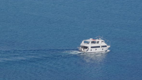 luxury yacht cruising in deep blue open ocean sea