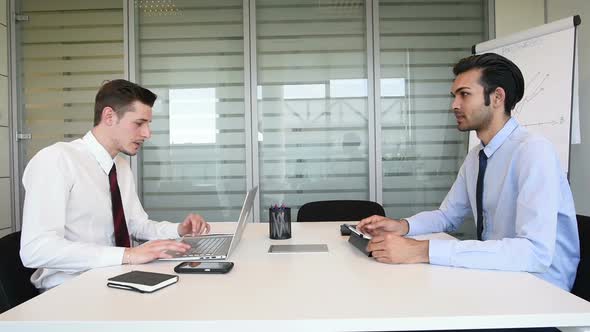 Two millennials businessman having job interview