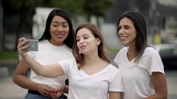 Smiling Young Women Recording Video Message