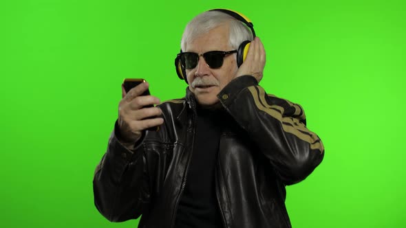 Elderly Caucasian Grandfather Biker Man Dance, Listen Music. Chroma Key