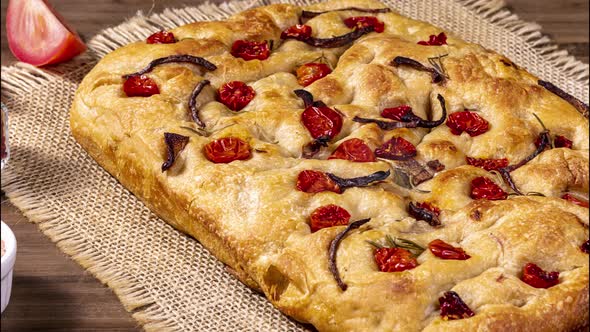 Traditional Italian Focaccia with pepperoni, cherry tomatoes, black olives, rosemary ando onion - ho