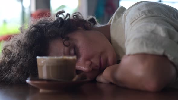 Sleepy Tired Overworked Woman Taking a Nap in Cafe Morning Coffee for Energy Exhaustion and Stress