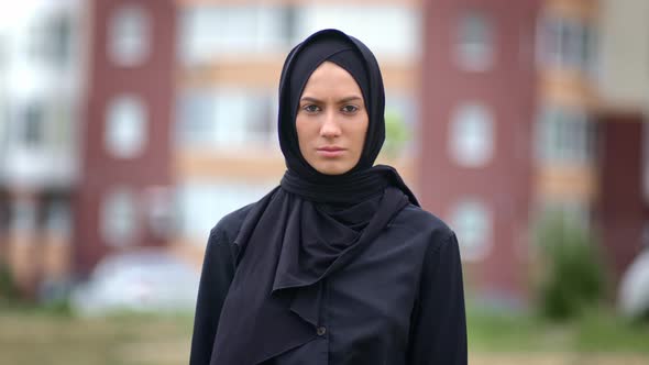 Portrait Beautiful Modern Muslim Woman in Traditional Black Headscarf Posing at Muslim City Building