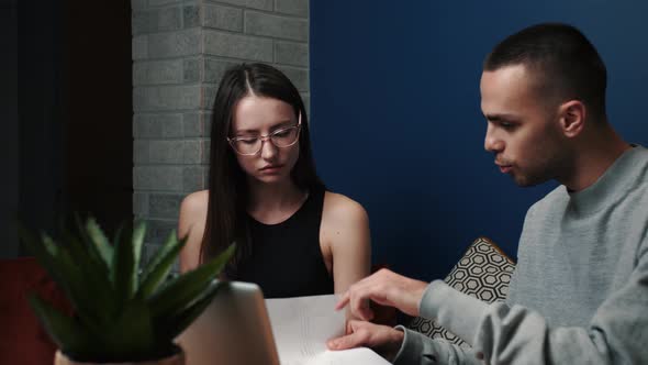 Frustrated Young Adult Man and Woman Feeling Stressed About Doing Paperwork at Home or Office. Angry