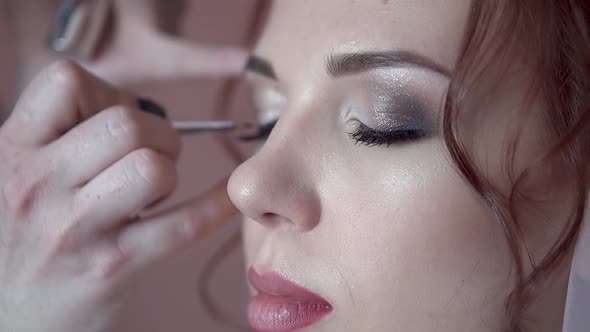 Make-up Artist Paints the Eyes of the Bride in the Morning Before the Wedding, Close-up, Slow Motion