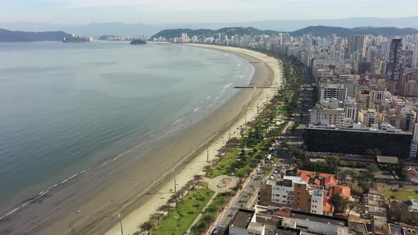 Panning wide landscape of coast city of Santos state of Sao Paulo Brazil.