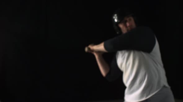 Baseball player hitting ball with bat, Slow Motion