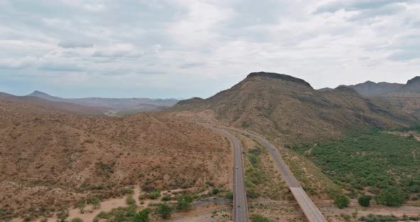 Aerial View Rock Mountains in the High Desert in the Middle of the Highway of Arizona