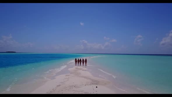 Tourists best friends on perfect coast beach adventure by blue green ocean and white sand background