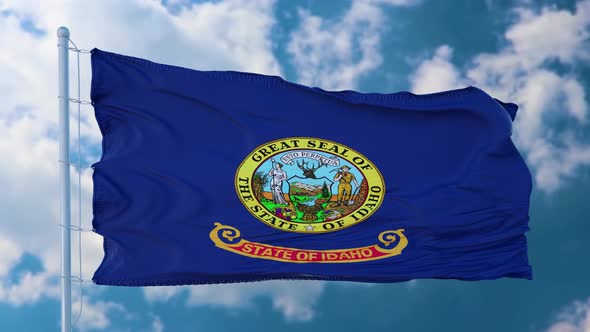 Idaho Flag on a Flagpole Waving in the Wind in the Sky