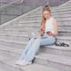 Young woman flexible worker outdoor using computer and smartphone - VideoHive Item for Sale