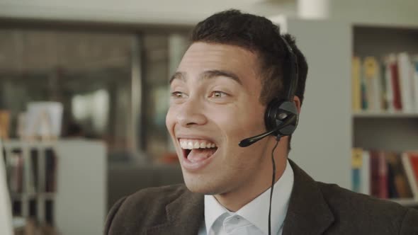 Happy Friendly Latino Ethnic Business Man Telemarketing Operator Wear Wireless Headset Microphone