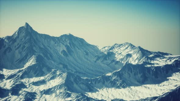 Aerial View of the Alps Mountains in Snow alt