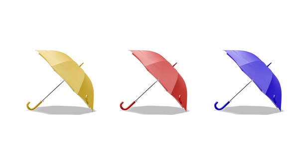 Blank colored open umbrella set lying, looped rotation