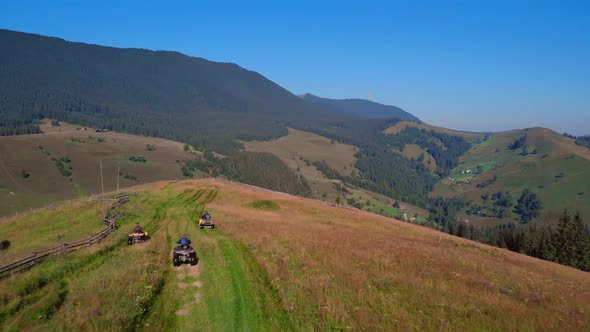 Alpine Scene with People Riding Quad Bikes