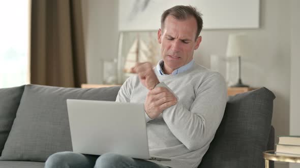 Hardworking Middle Aged Businessman Having Wrist Pain 