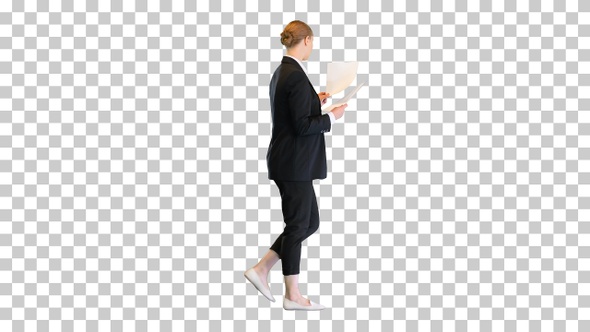 Young business woman looking through documents, Alpha Channel