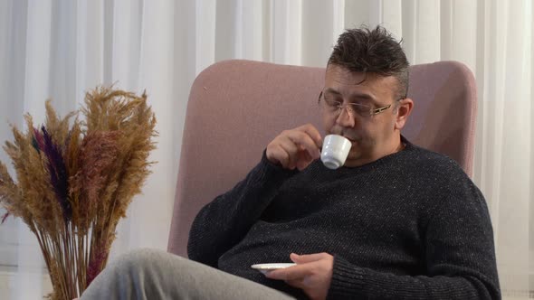 Thoughtful man drinking coffee.