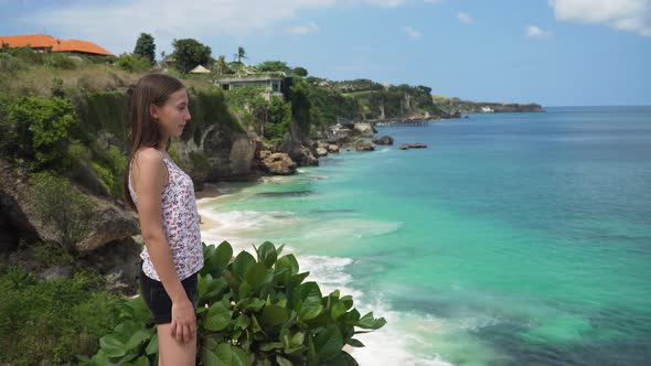 Girl Standing Cliff Looking Sea