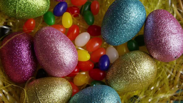 Rotating shot of Easter decorations and candy in colorful Easter grass - EASTER 016