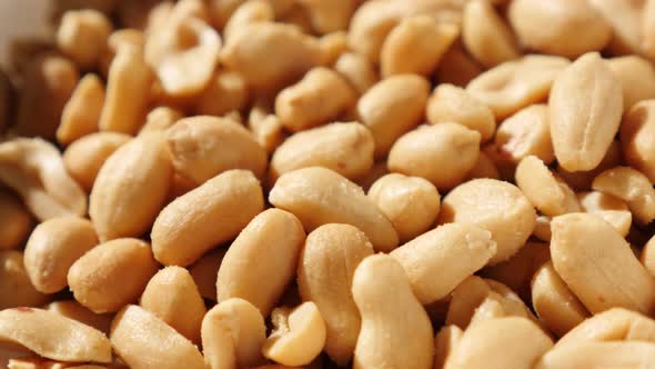 Served in a bowl tasty groundnut snack food slow tilting background 4K 2160p UltraHD video - Salted 