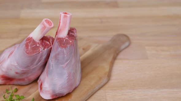 Young Sheep's Meat - Uncooked Lamb Chops On Wooden Cutting  Board. - close up