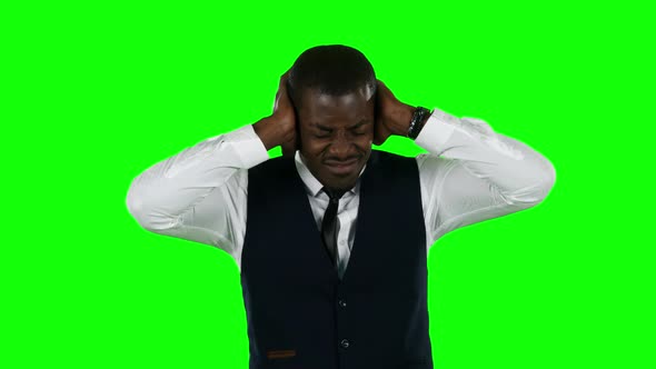 Businessman Shouting the Hands on His Ears. Green Screen