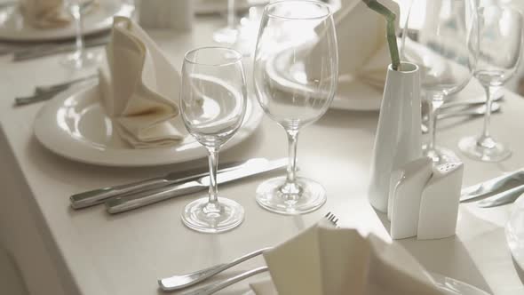 Close Up Shot of the Table Covered with a Tablecloth, There Are Cutlery on It