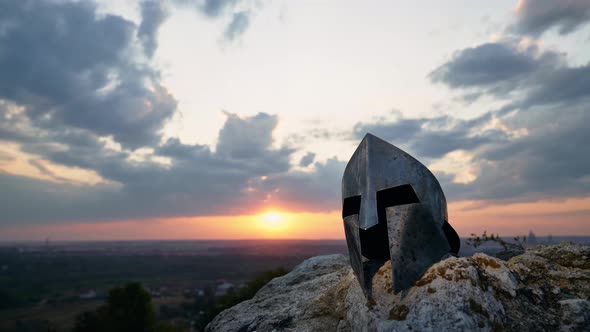 Ancient Helmet, Cloudy Sunset on Background.