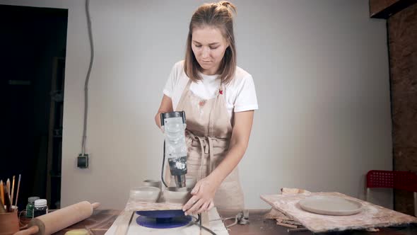 Girl Drying Her Clay Products