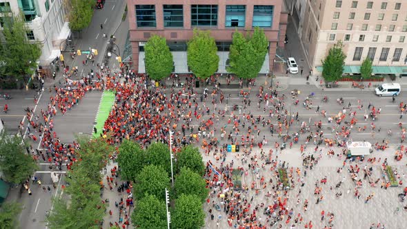 A Political Rally on the Road in a Big City Urban Centre, Drone Slide Right View in UHD. Native Peop