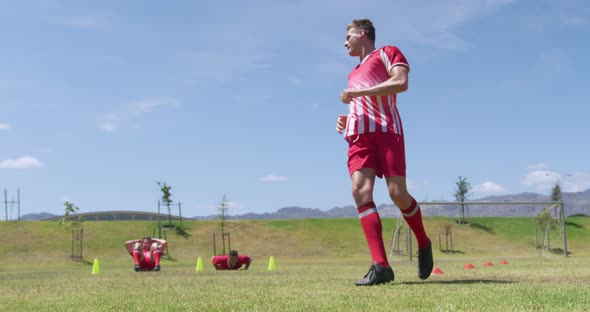 Soccer players training on field