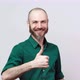 Happy bearded man showing thumbs up sign over white background. Good job. - VideoHive Item for Sale