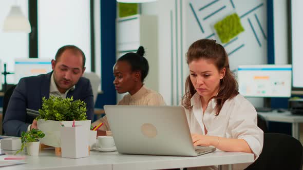 Focused Woman Manager Typing on Laptop Browsing on Internet